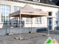 Personnalisation sur les volants d'une tente pliante 3x3 Solid 50 pvc beige pour la commune de Ichtegem